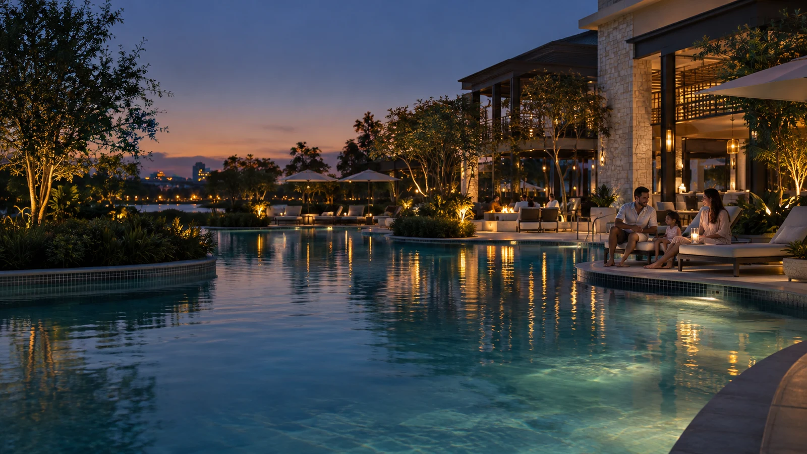 Family relaxing beside a luxury Orlando resort pool at blue hour
