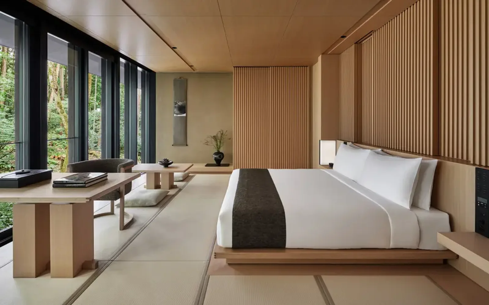 Susuki room at Aman Kyoto with platform bed, wooden screens, and garden views.