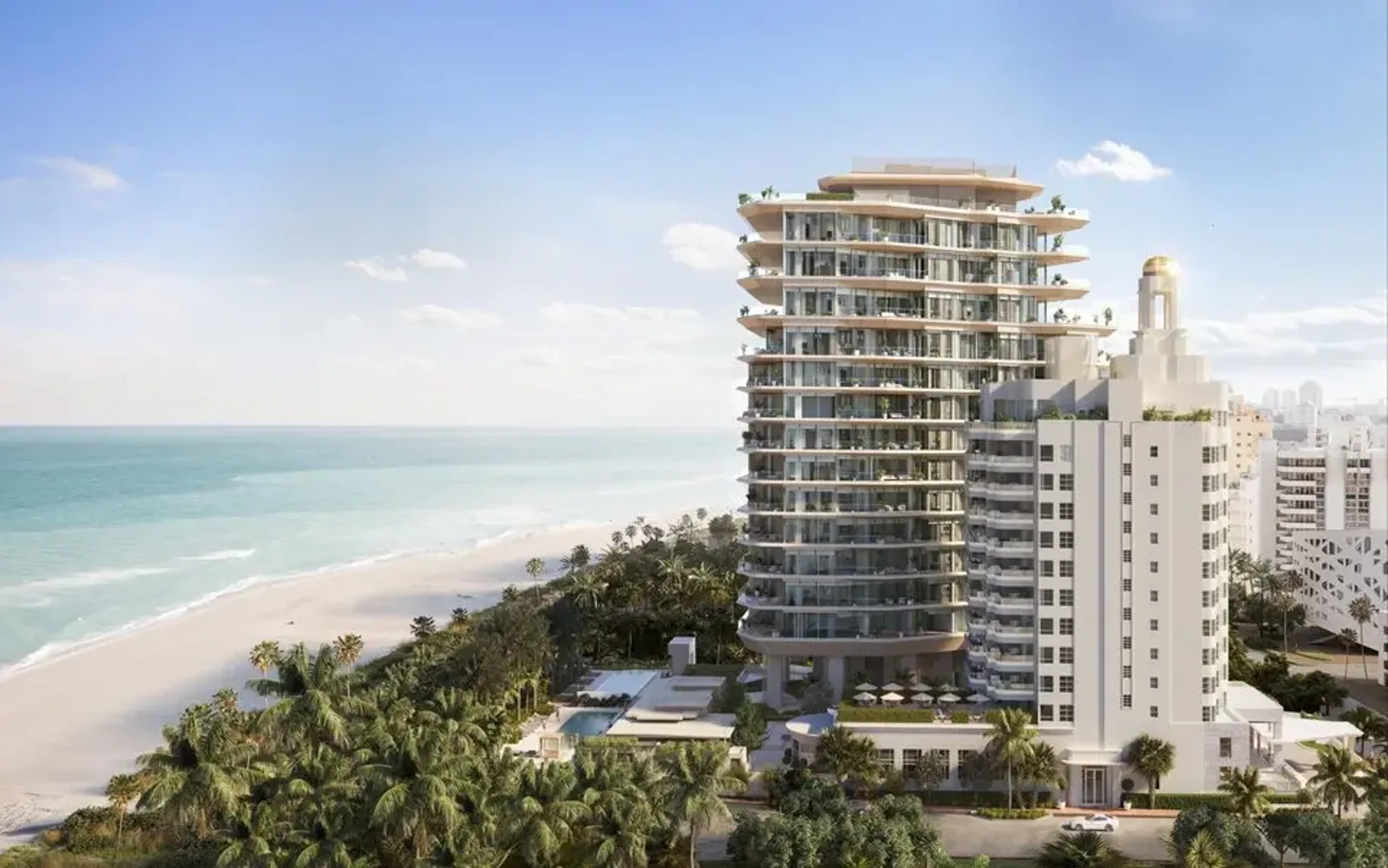 Aman Miami Beach rises above pristine sandy beach and turquoise Atlantic waters, aerial view.
