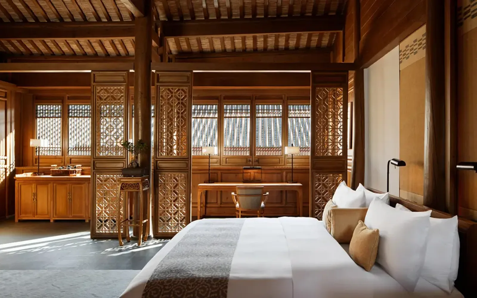 Principal bedroom at Amandayan with wooden architectural details and traditional furnishings.
