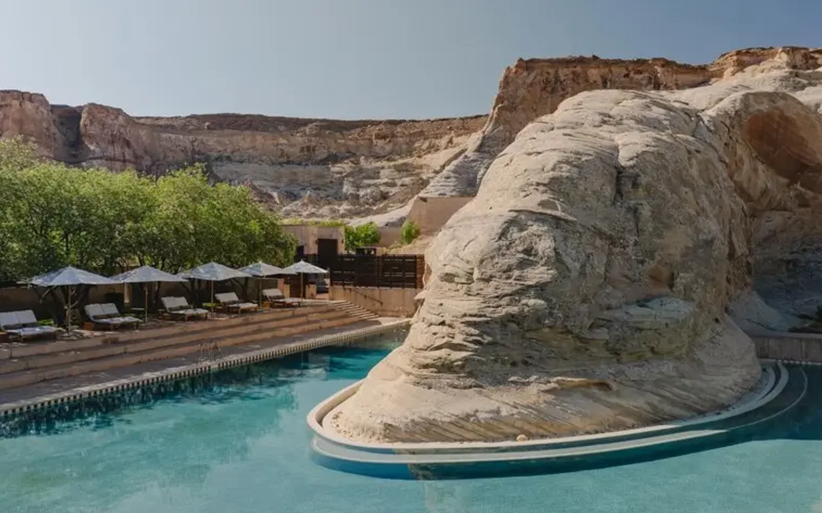 Amangiri's plunge pool nestled against desert rock formations in Utah.