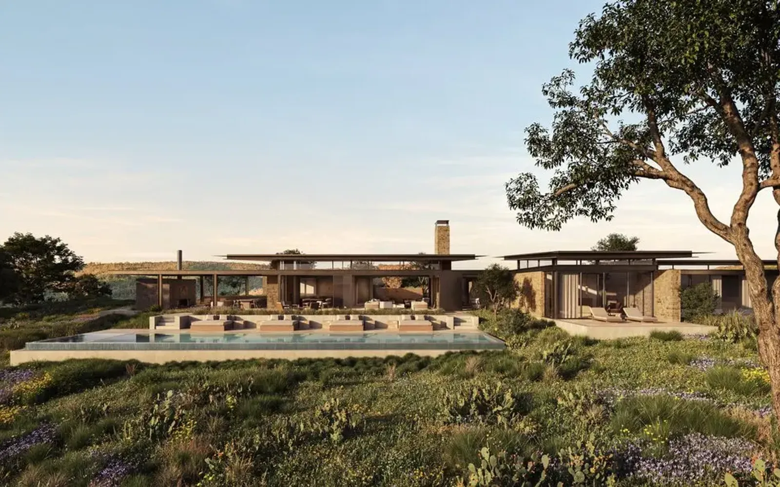 Aman Residences Amansanu exterior with poolside pavilion and manicured gardens at dusk.