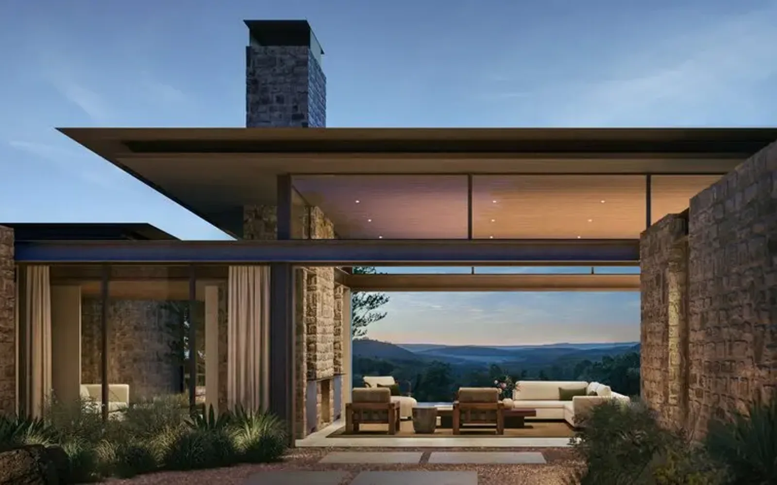Contemporary stone residence with open-plan living area and expansive sea views at Aman Residences Amansanu.