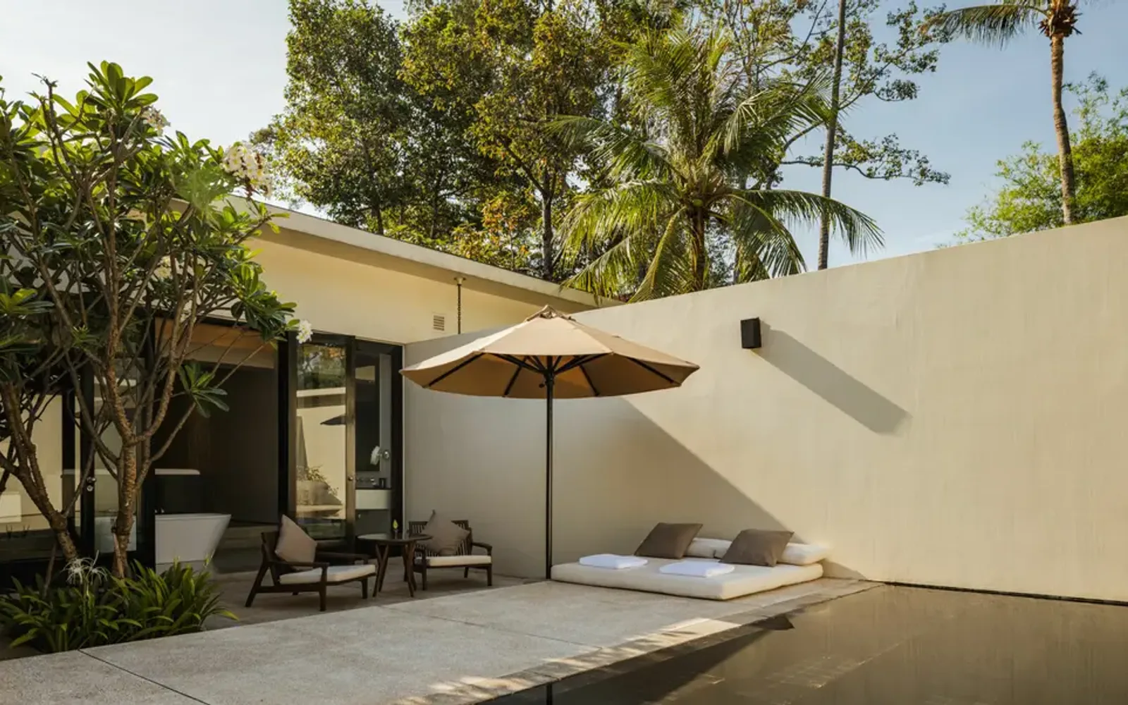 Amansara's spa pavilion with canvas canopy and peaceful courtyard garden in Cambodia.
