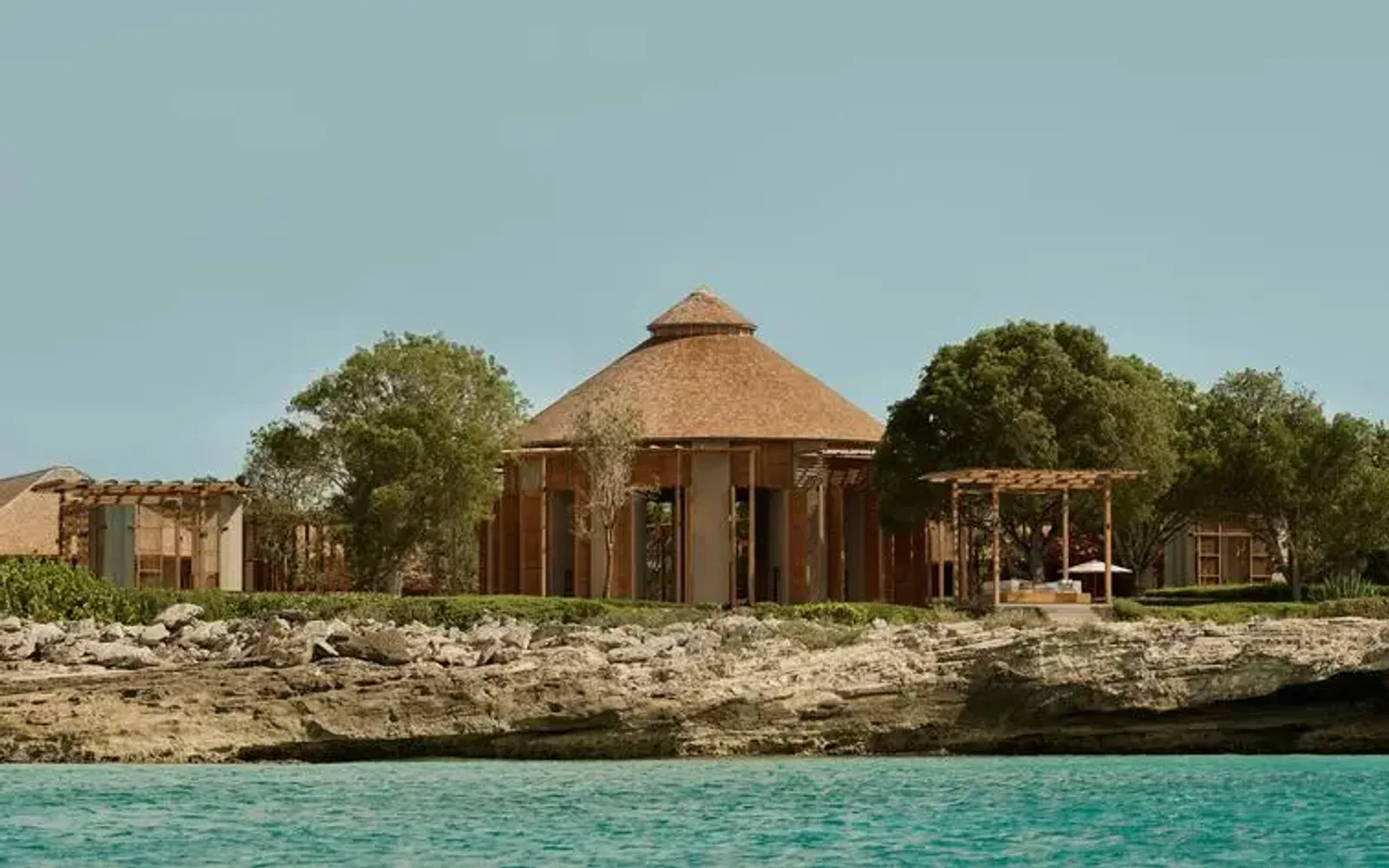 Bar pavilion at Amanyara viewed from the turquoise waters of Turks and Caicos.