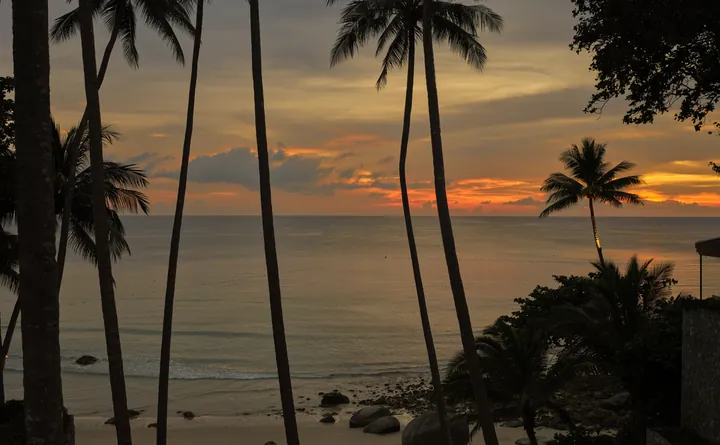 The beach and Andaman Sea at Amanpuri at sunset