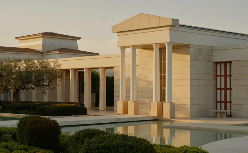 Classical architecture and reflecting water at Amanzoe