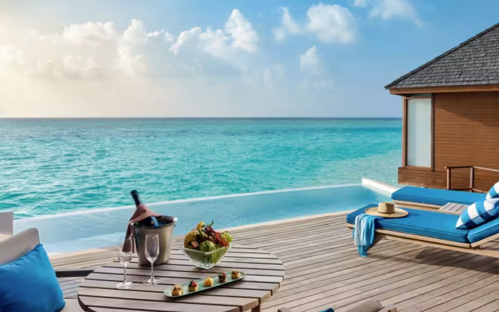 Over Water Pool Suite Deck with Loungers at Anantara Dhigu Maldives Resort