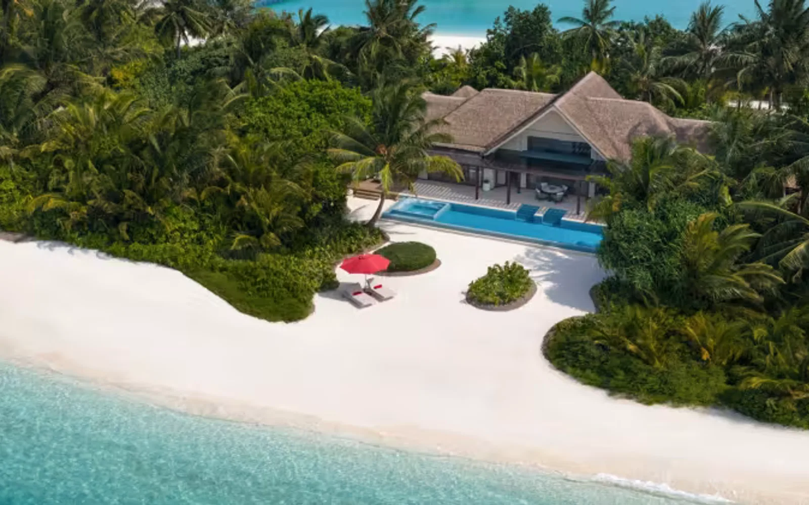 Aerial view of a beach pool villa at Niyama Private Island Maldives set along a white-sand beach