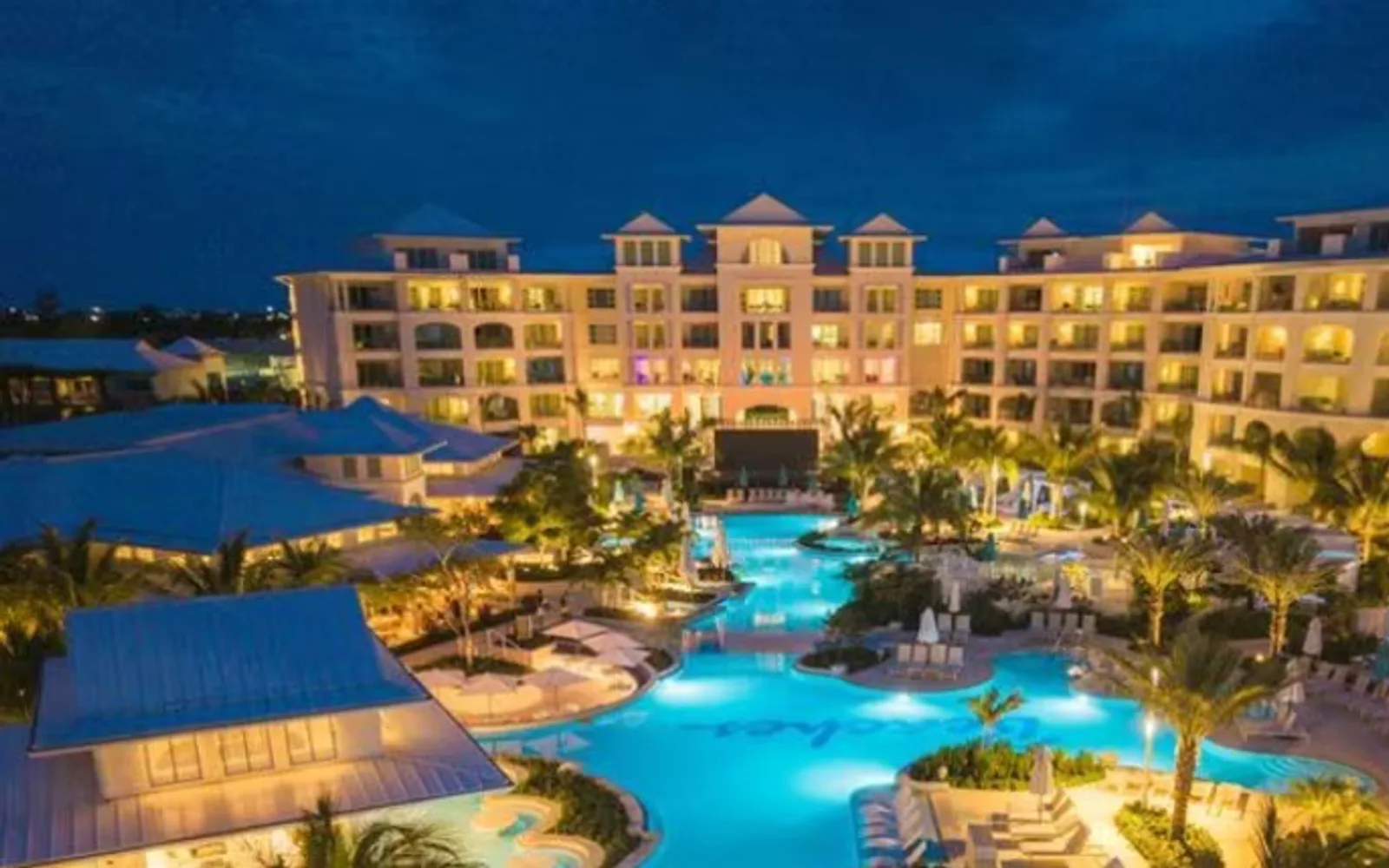 Beaches Turks and Caicos resort pool and guest spaces at dusk on Grace Bay.