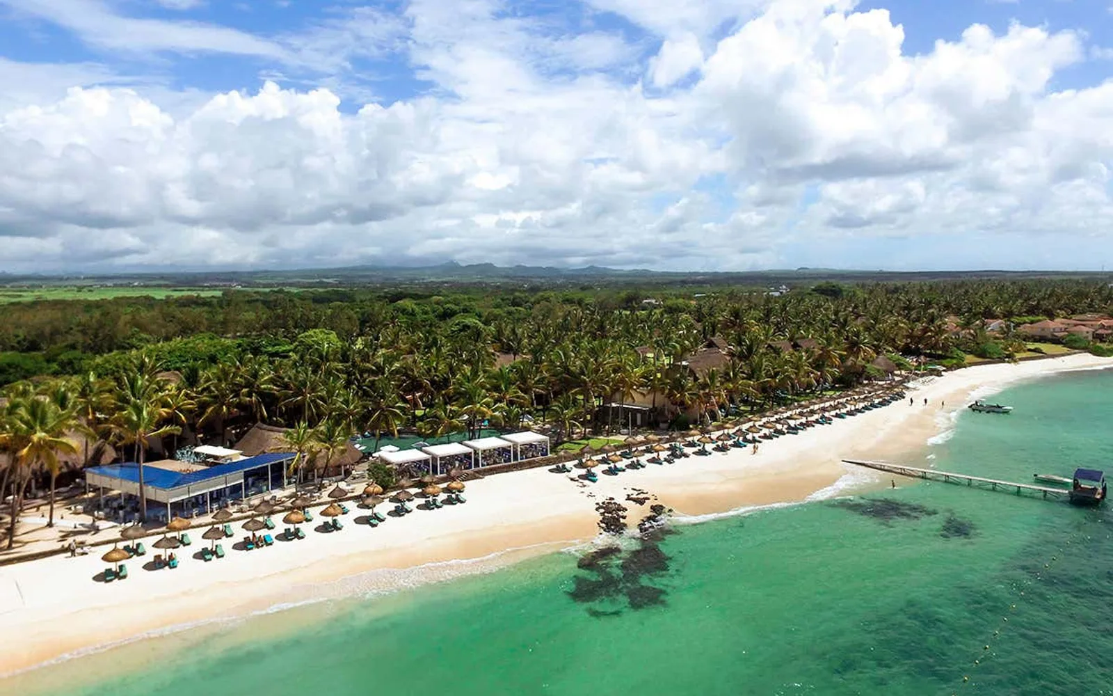 Aerial view of Constance Belle Mare Plage and the Mauritius coast.