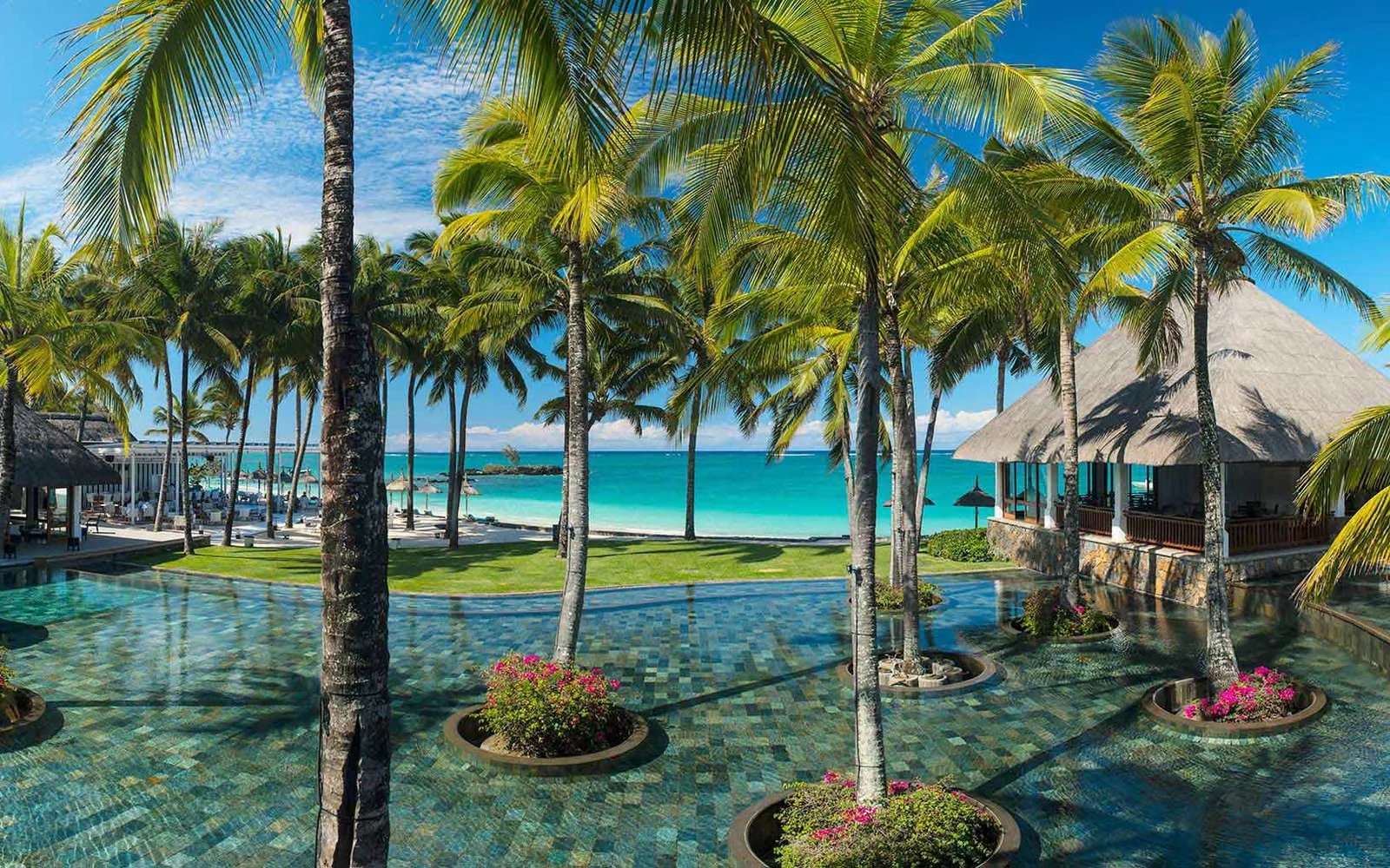 Pool and beach view at Constance Belle Mare Plage.
