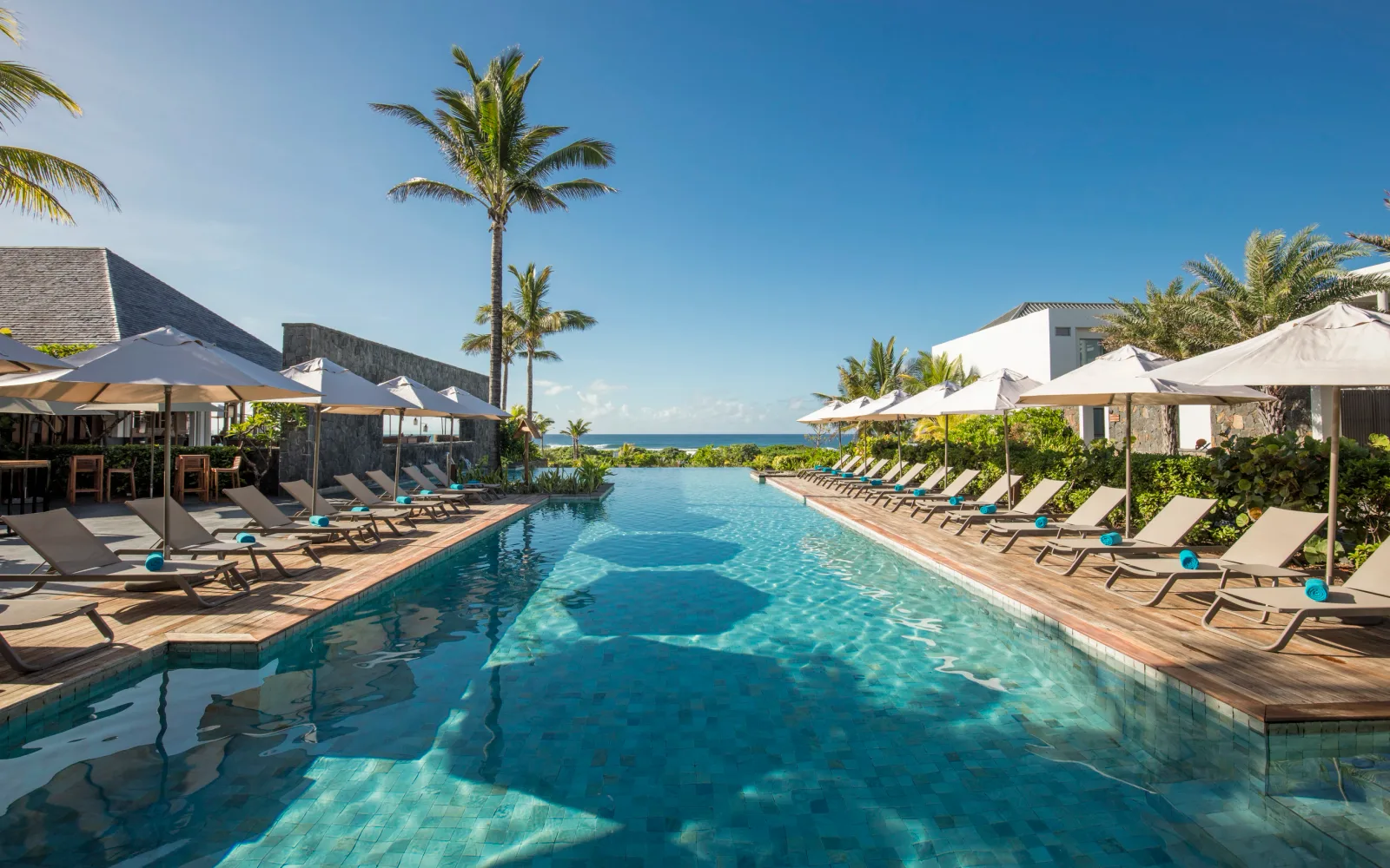 The pool and natural coastal setting at Constance Le Chaland.