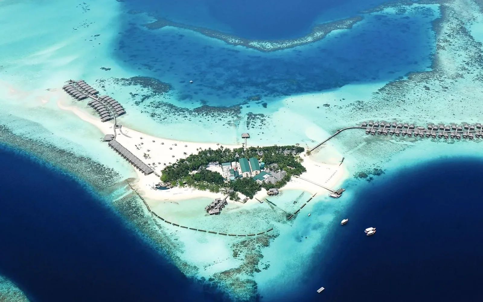 Aerial view of Constance Moofushi and its overwater villas.