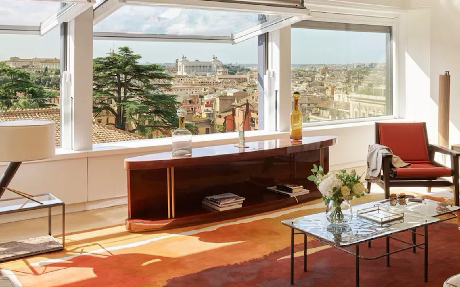 Bellavista Penthouse Suite living room with windows open and view at Hotel Eden, Rome