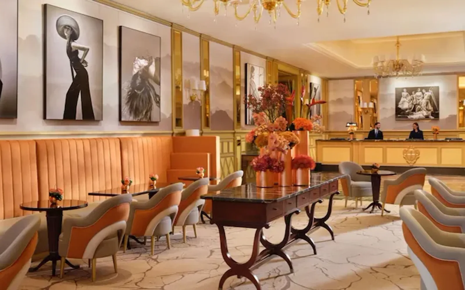 A view of 'Il Salotto’ with its characteristic orange, grey and ivory colours. The reception desk is in the background.