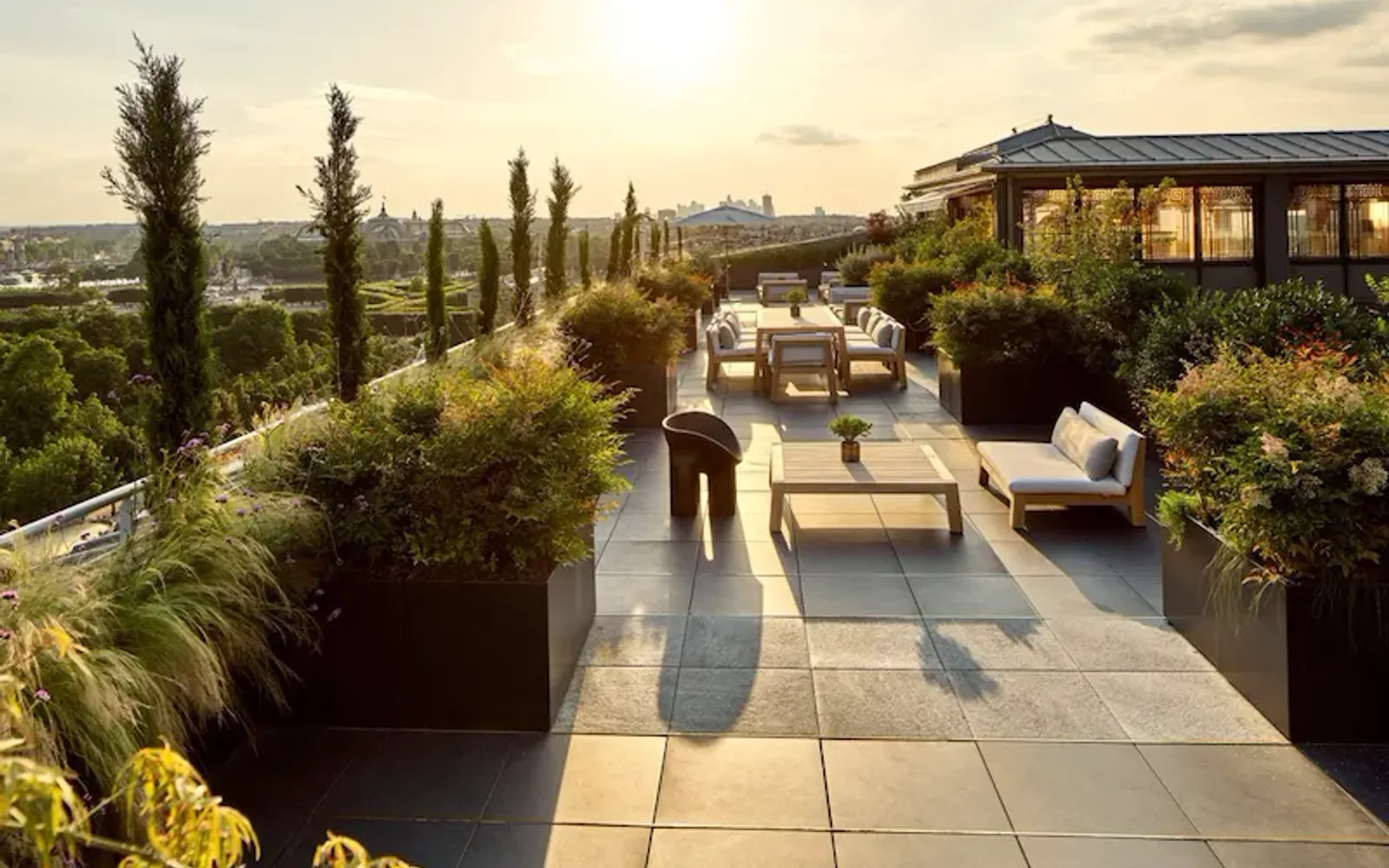 Belle Etoile suite terrace with sunset view of Eiffel Tower, at Le Meurice, Paris.