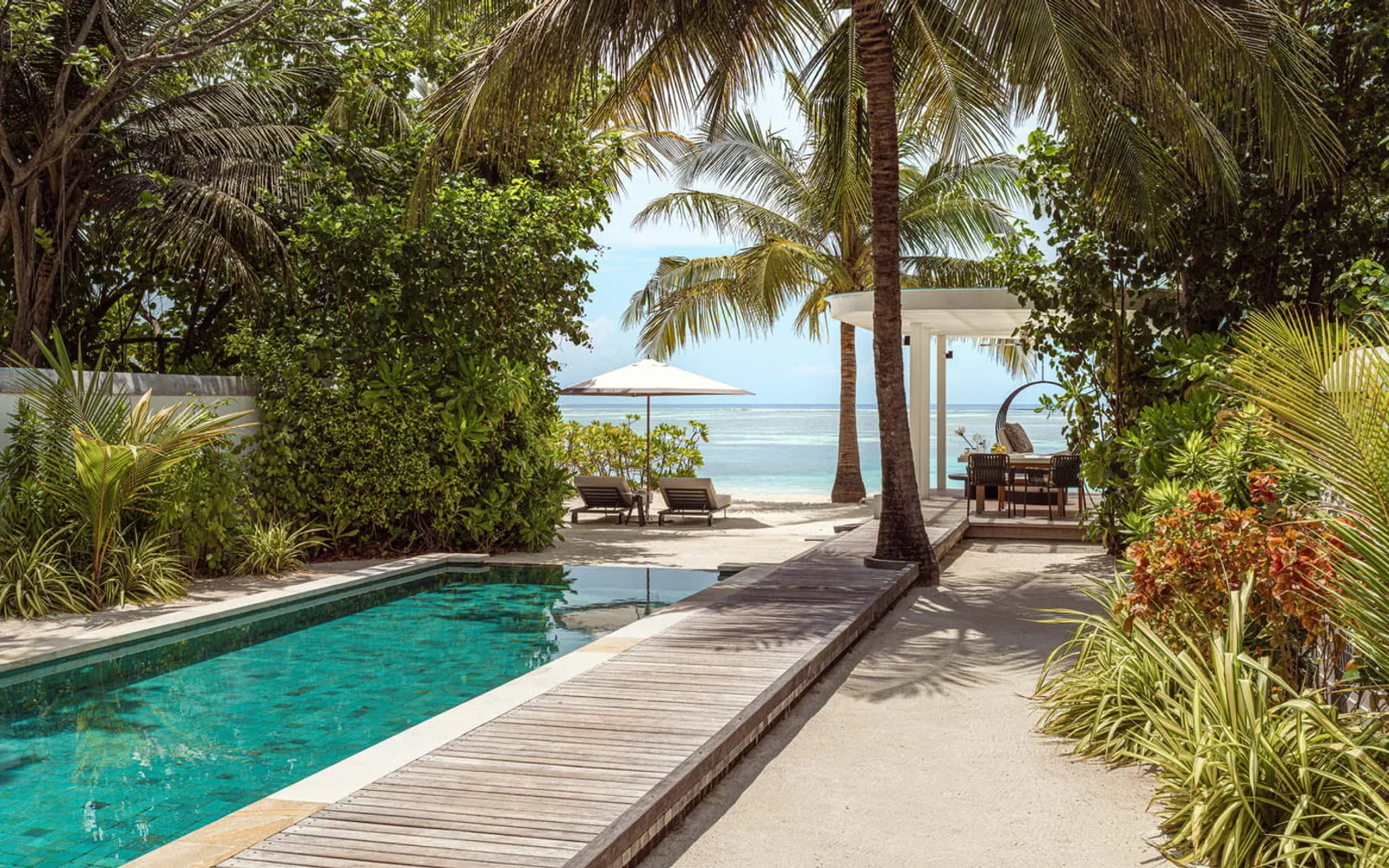 Four Seasons Resort Maldives at Kuda Huraa, official Four Seasons photography for the dining section.