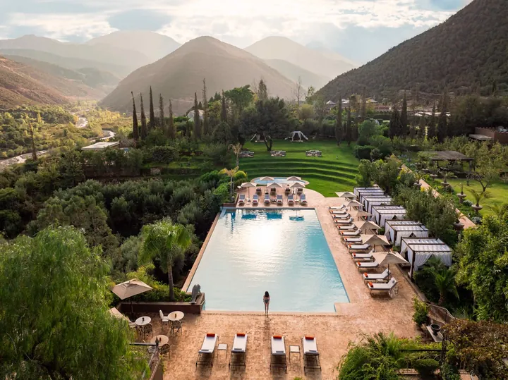 Outdoor pool and gardens with Atlas Mountain views at Kasbah Tamadot