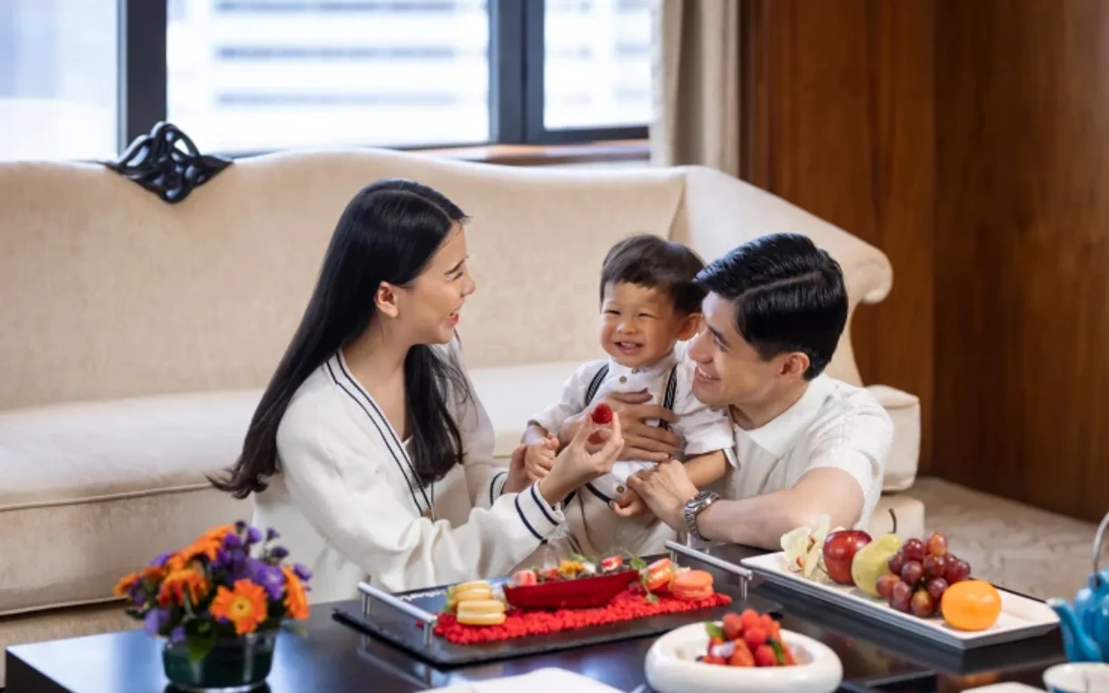 Family enjoying welcome amenities in the room at Mandarin Oriental, Jakarta