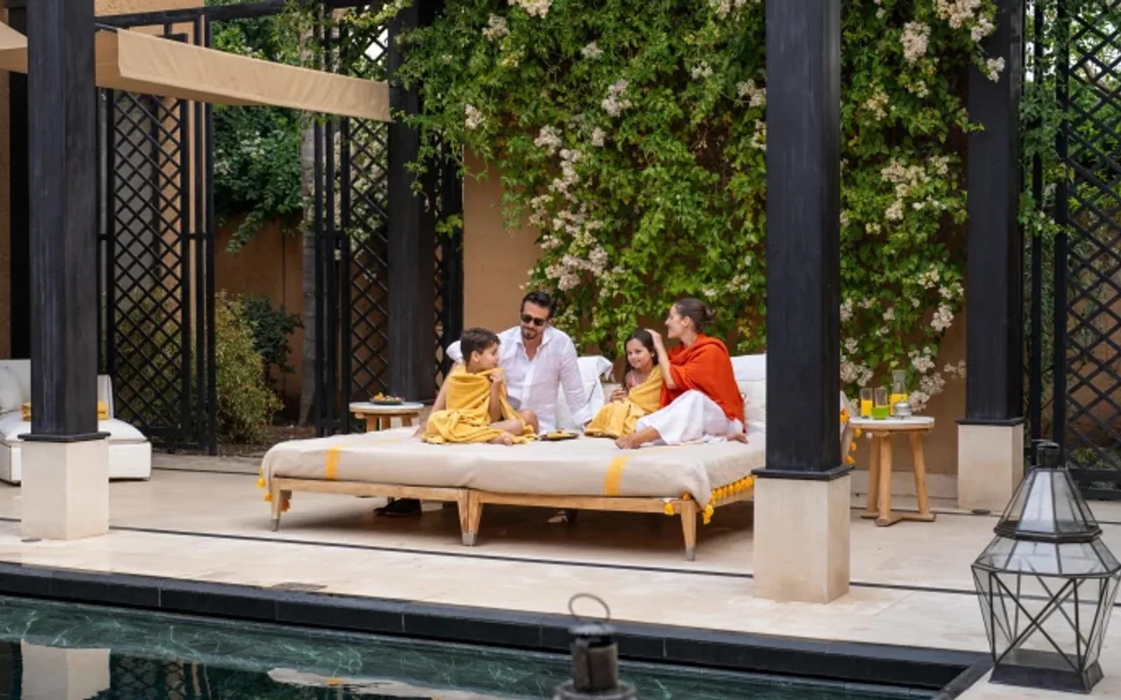 Family on sunbed in the Terrace Villa, Mandarin Oriental, Marrakech
