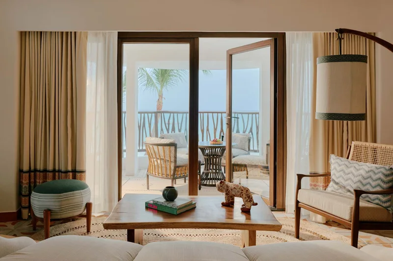 Oceanfront Suite living area and balcony at Maroma
