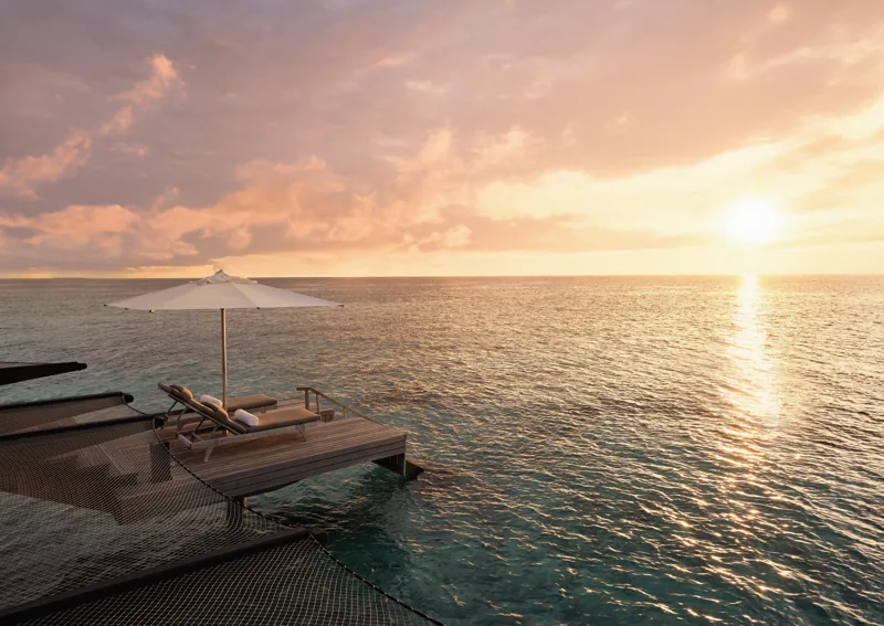 Sunset beside the water at One&Only Reethi Rah