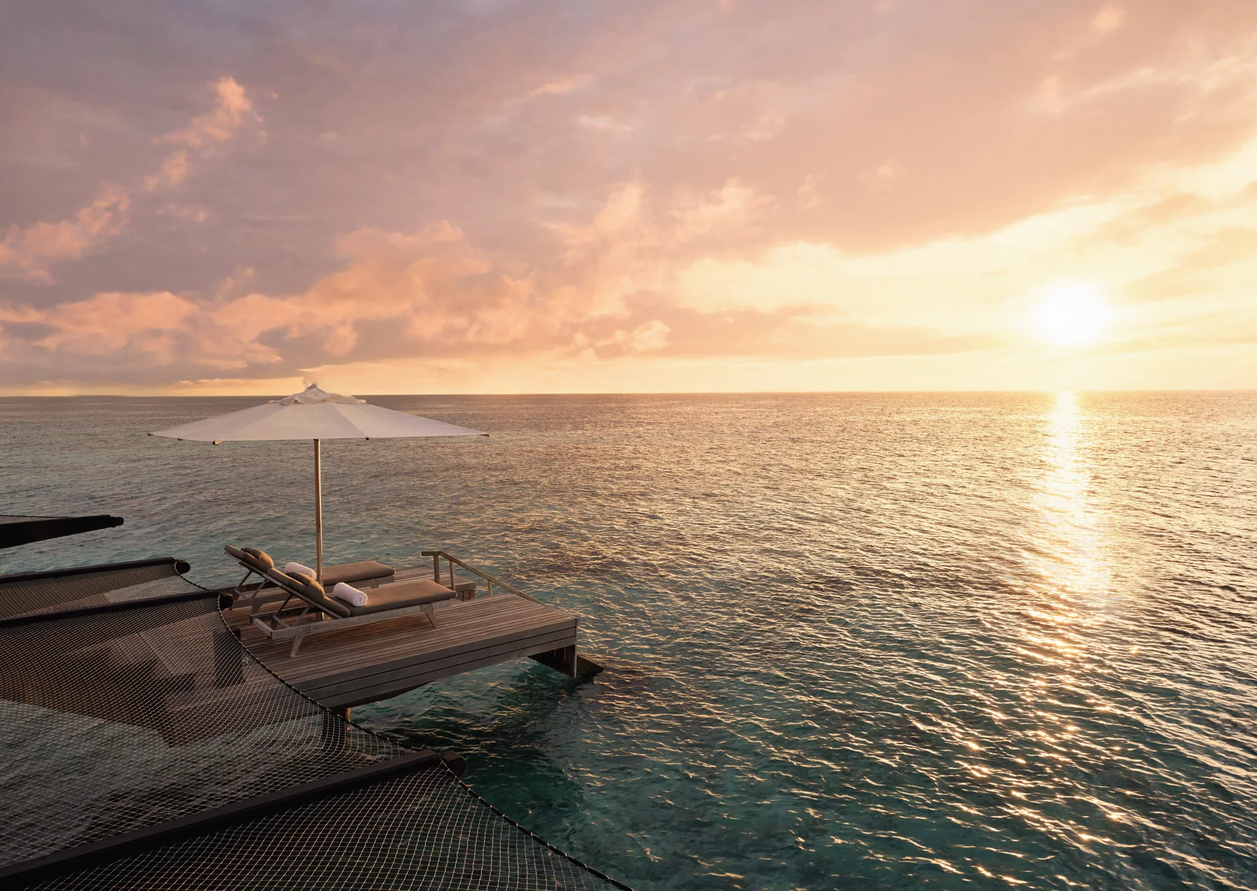 Sunset beside the water at One&Only Reethi Rah
