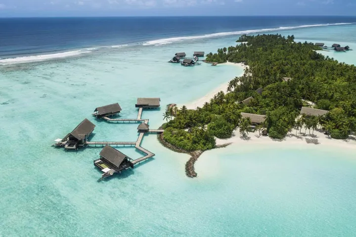 Overwater villas and lagoon at One&Only Reethi Rah, Maldives