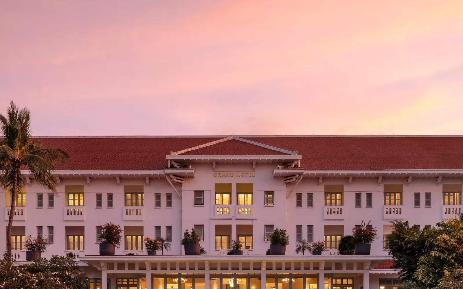 Raffles Grand Hotel d'Angkor heritage exterior at sunset