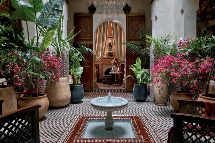 Plant-filled riad courtyard with a central fountain at Royal Mansour Marrakech