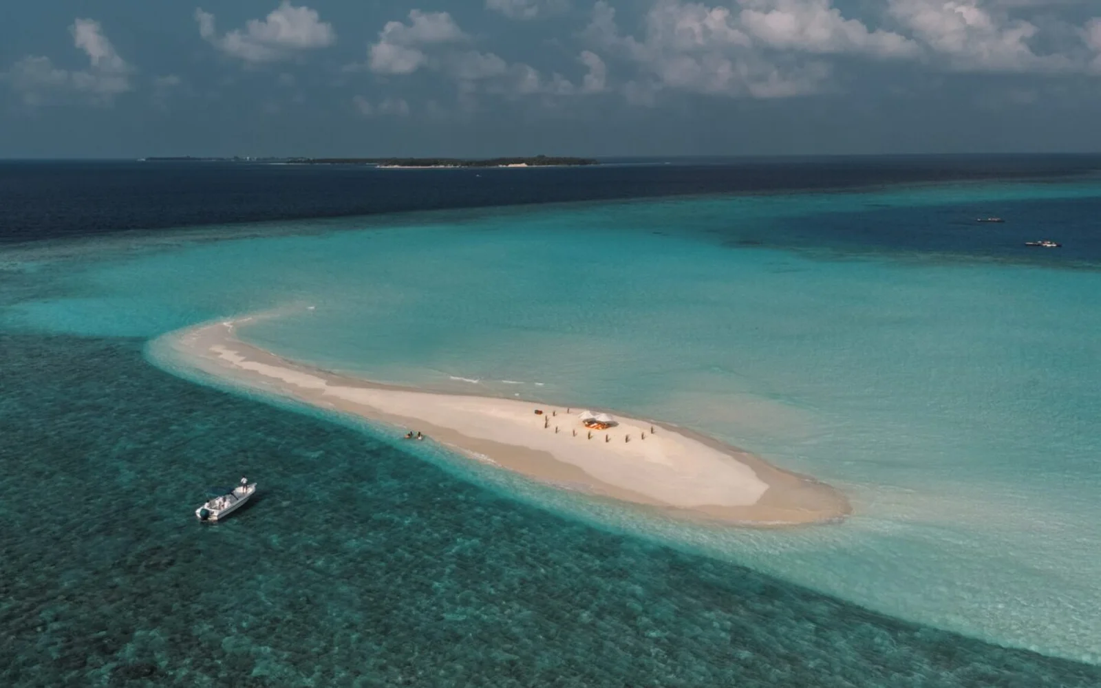 Quiet beach and blue water at Soneva Fushi